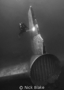 Aircraft tail and diver, Capernwray by Nick Blake 